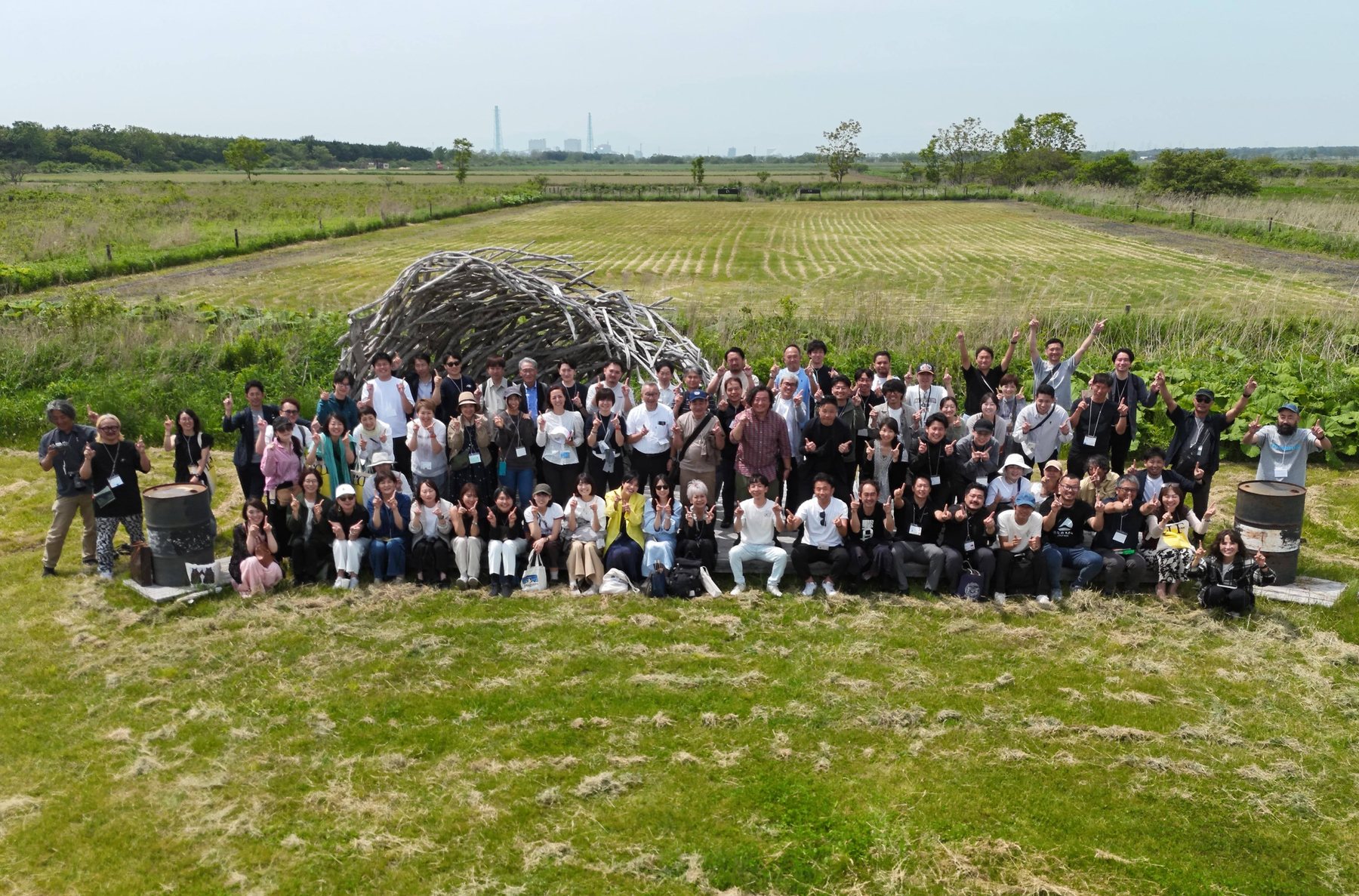 Organic study tour 2026, Hokkaido, Japan — around 100 participants gathered before wide farmland