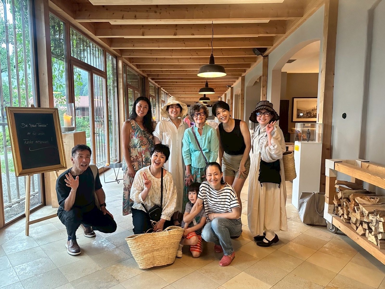 Bio-hotel stay in Southern Germany (2026) — participants in a light-filled wooden interior